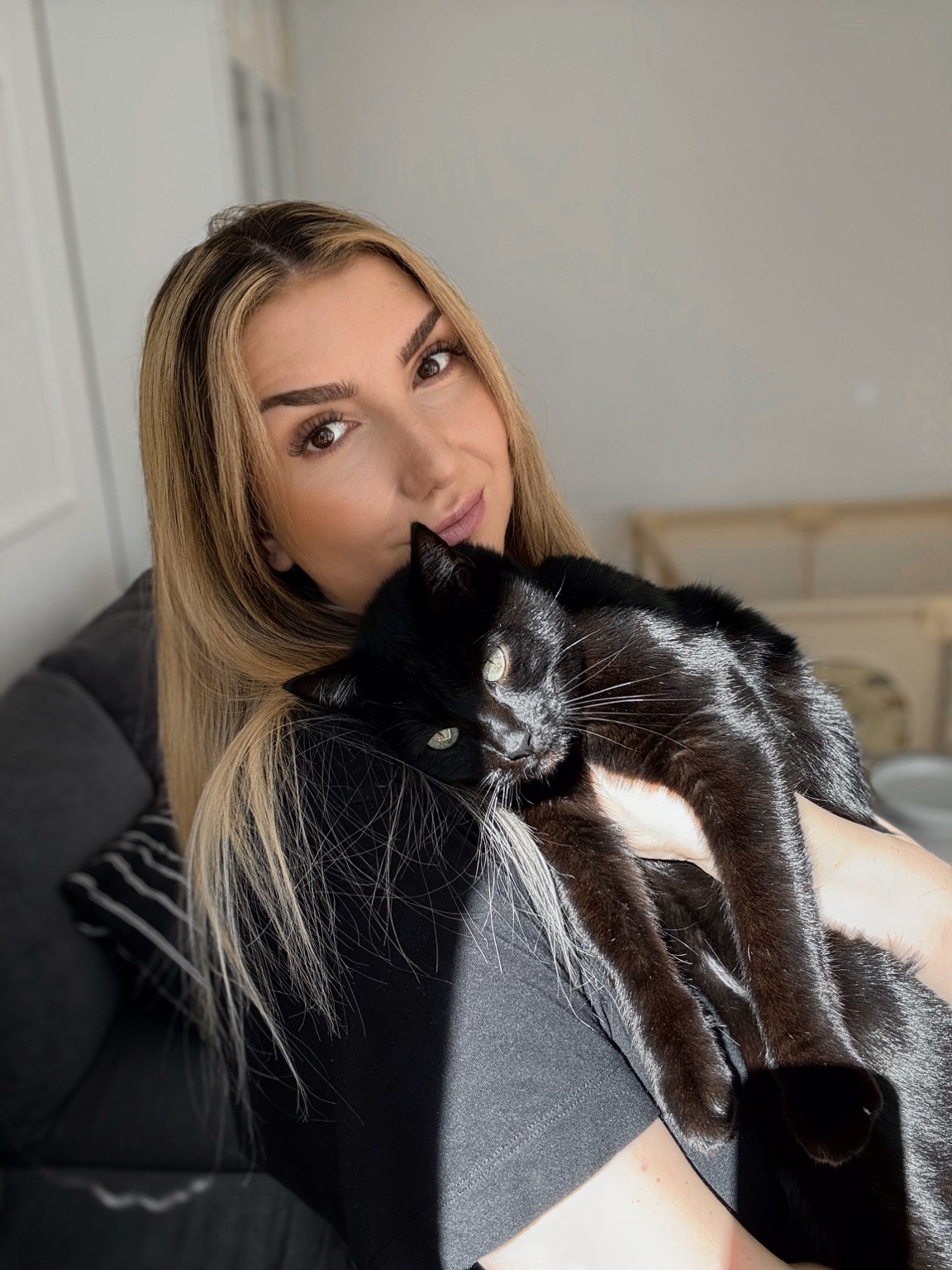Lena holding her black cat